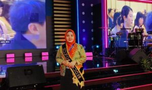 Ny. Elvi Sukaisi Kopli Ansori